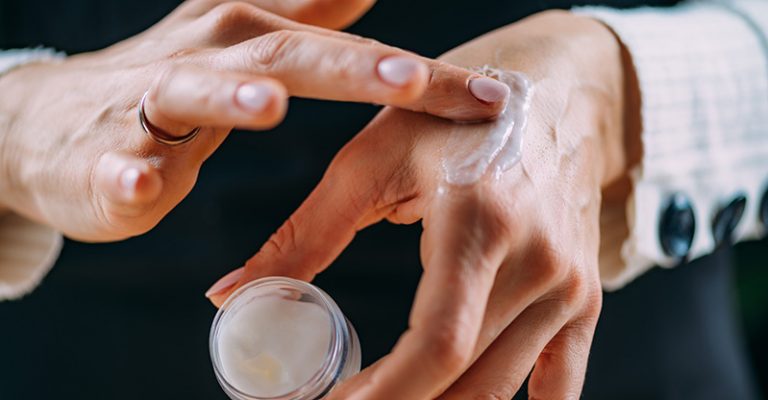 woman applying homemade hand cream